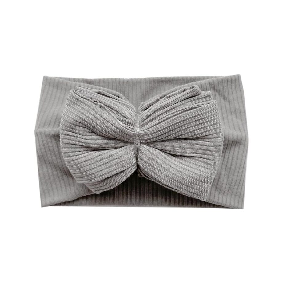 A grey Ellie - Bamboo Baby Knotted Headwrap with a bow from Tiny Knot Co.