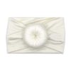 A Nora   Bamboo Baby Knotted Headwrap featuring a Tiny Knot Co ball 