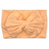 A Nora   Bamboo Baby Knotted Headwrap by Tiny Knot Co on a white background 