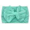 A tiny knot co mint green Nora   Bamboo Baby Knotted Headwrap on a white background 