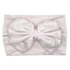 The Nora   Bamboo Baby Knotted Headwrap photographed on a white background by Tiny Knot Co 