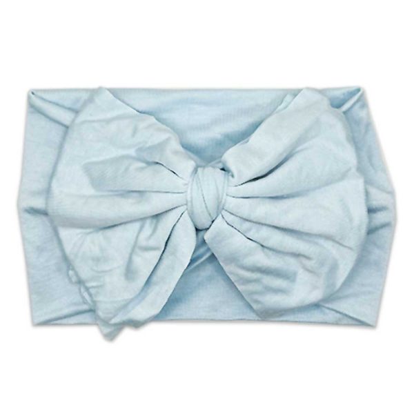 A Tiny Knot Co Nora - Bamboo Baby Knotted Headwrap headband with a bow on it.