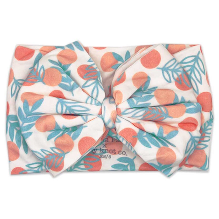 Gabrielle - Bamboo Baby Bow Headwrap - The Mejia Family x Tiny Knot Co. with leaves on it.
