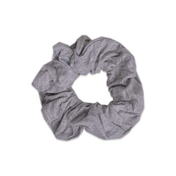 A grey scrunchie on a white background from Tiny Knot Co.