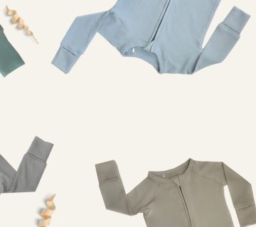 A group of Tiny Knot Co pajamas in different colors arranged on a white background.