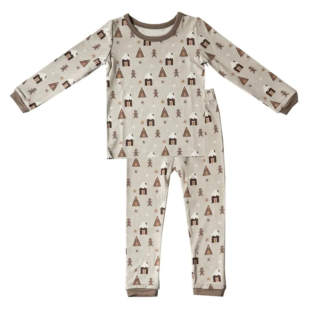 Beige TENCEL™ modal baby pajamas with festive brown prints, Tiny Knot Co
