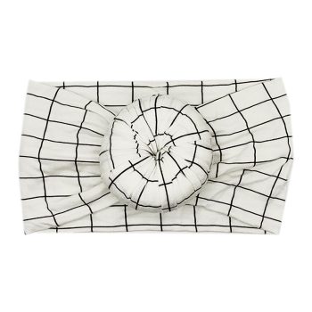 A Tiny Knot Co Ellie - Bamboo Baby Knotted Headwrap with a black and white checkered pattern.