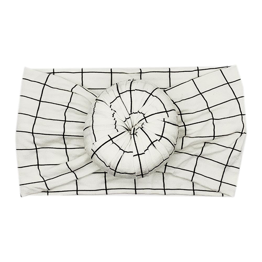 A Tiny Knot Co Ellie - Bamboo Baby Knotted Headwrap with a black and white checkered pattern.