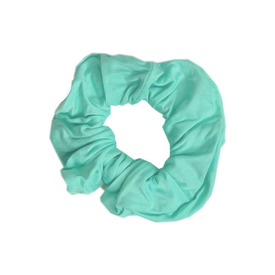 A turquoise scrunchie from Tiny Knot Co on a white background.