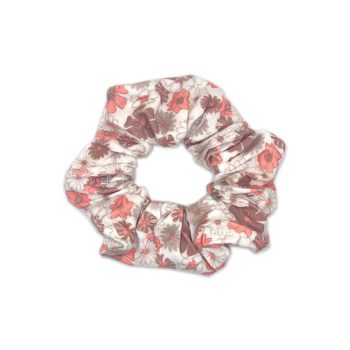 A Gabrielle - Bamboo Baby Bow Headwrap by the Tiny Knot Co with a red and white floral pattern.