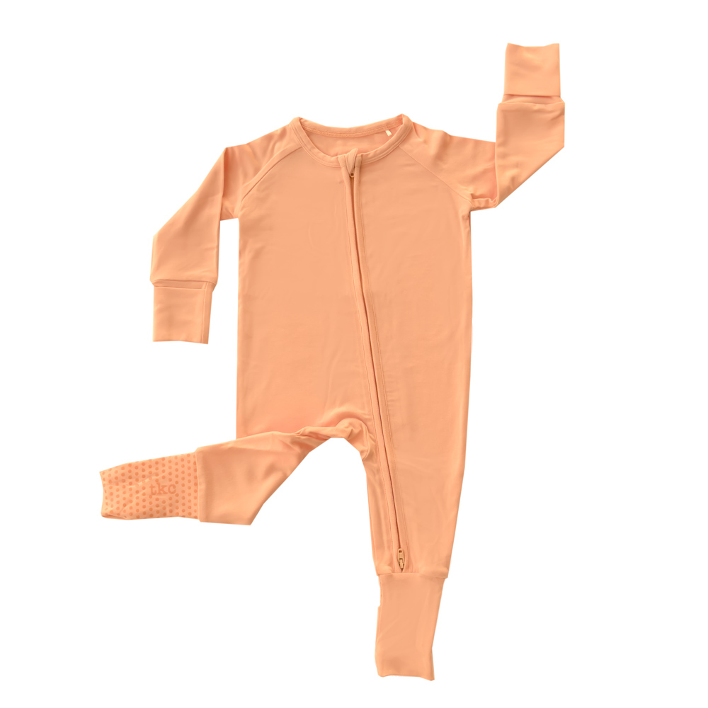 Peach long sleeve modal romper with grips, super soft  Tiny Knot Co 