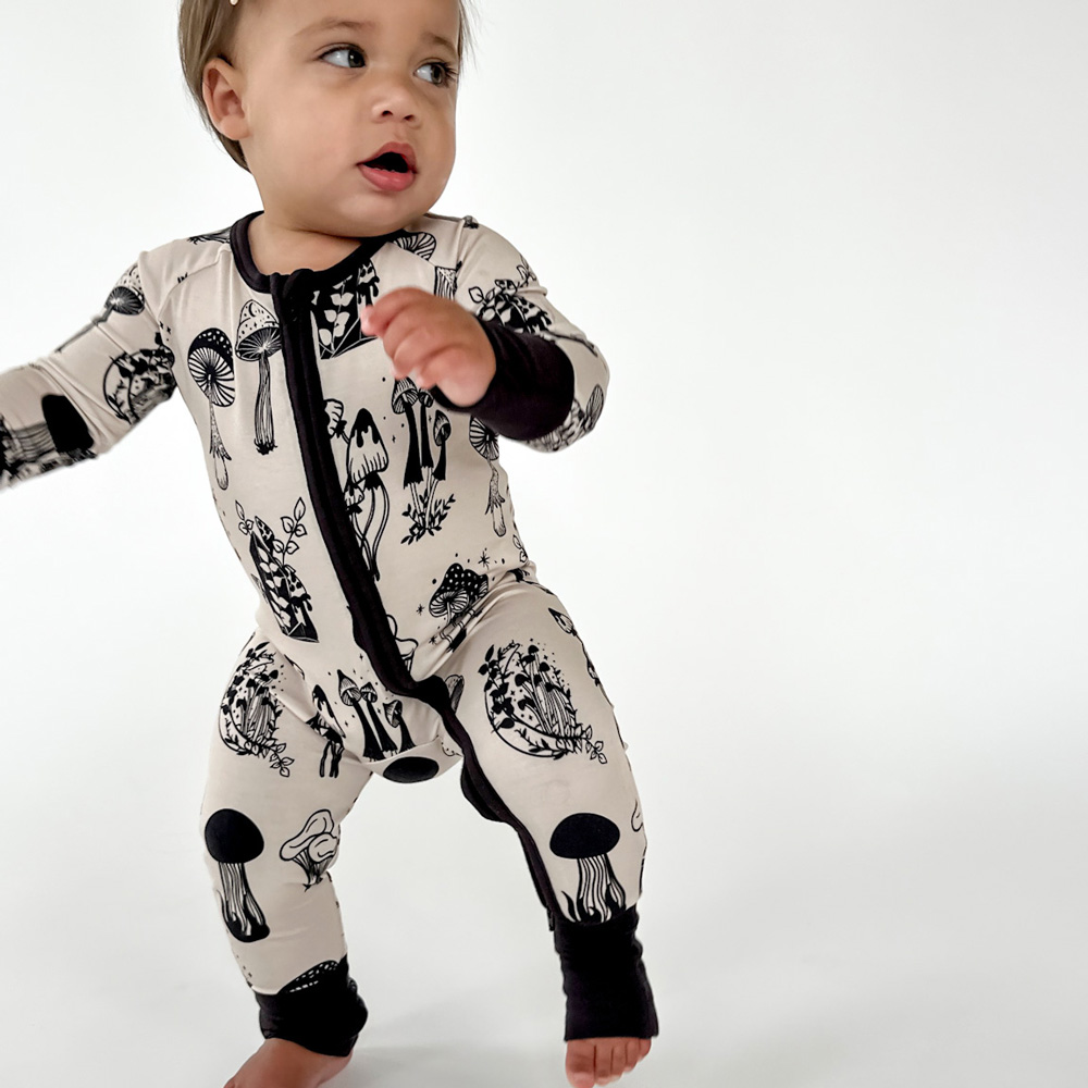 Baby in super soft TENCEL™ modal mushroom pajamas, Tiny Knot Co 
